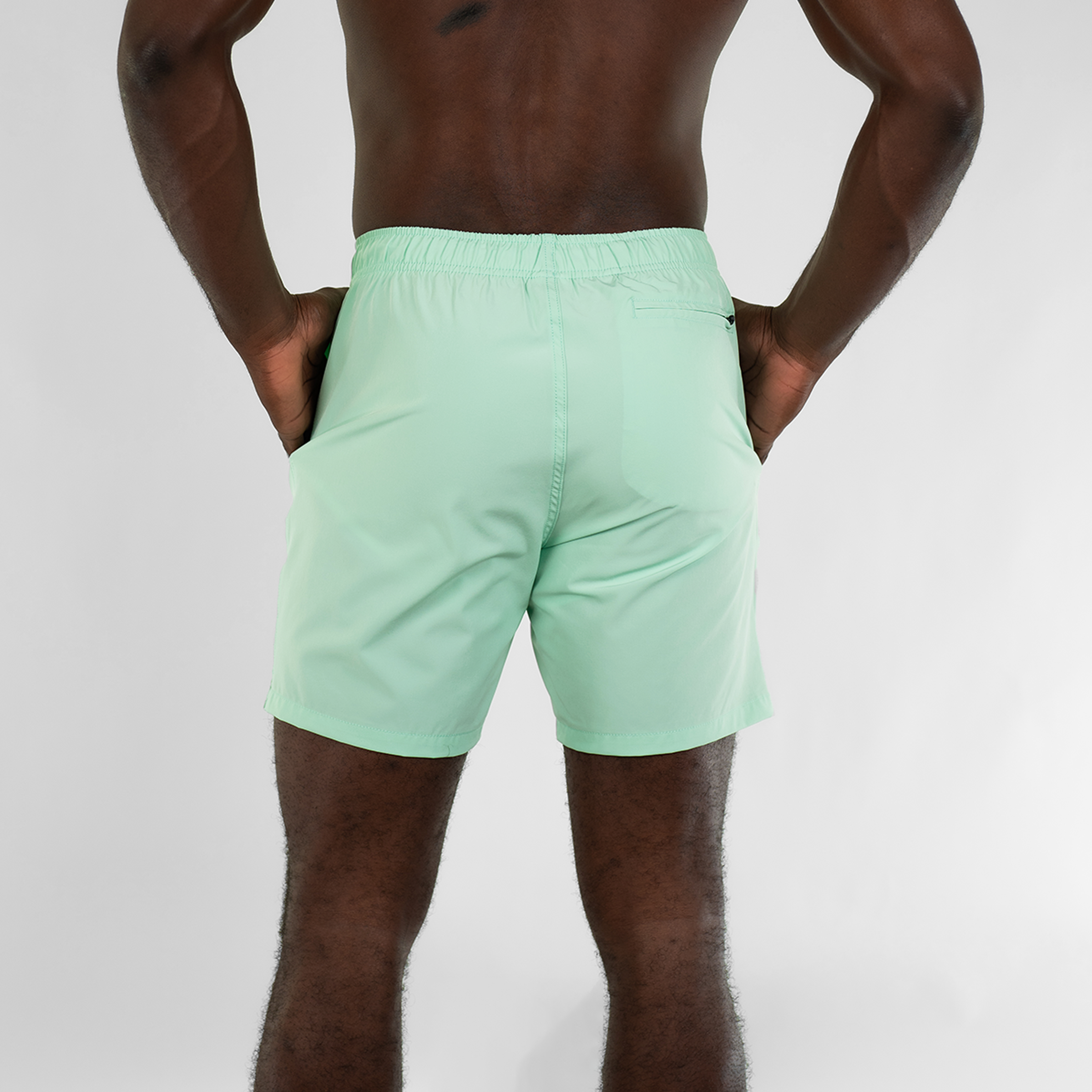 Stretch Swim 7" in Mint back on model with hands in inseam pockets