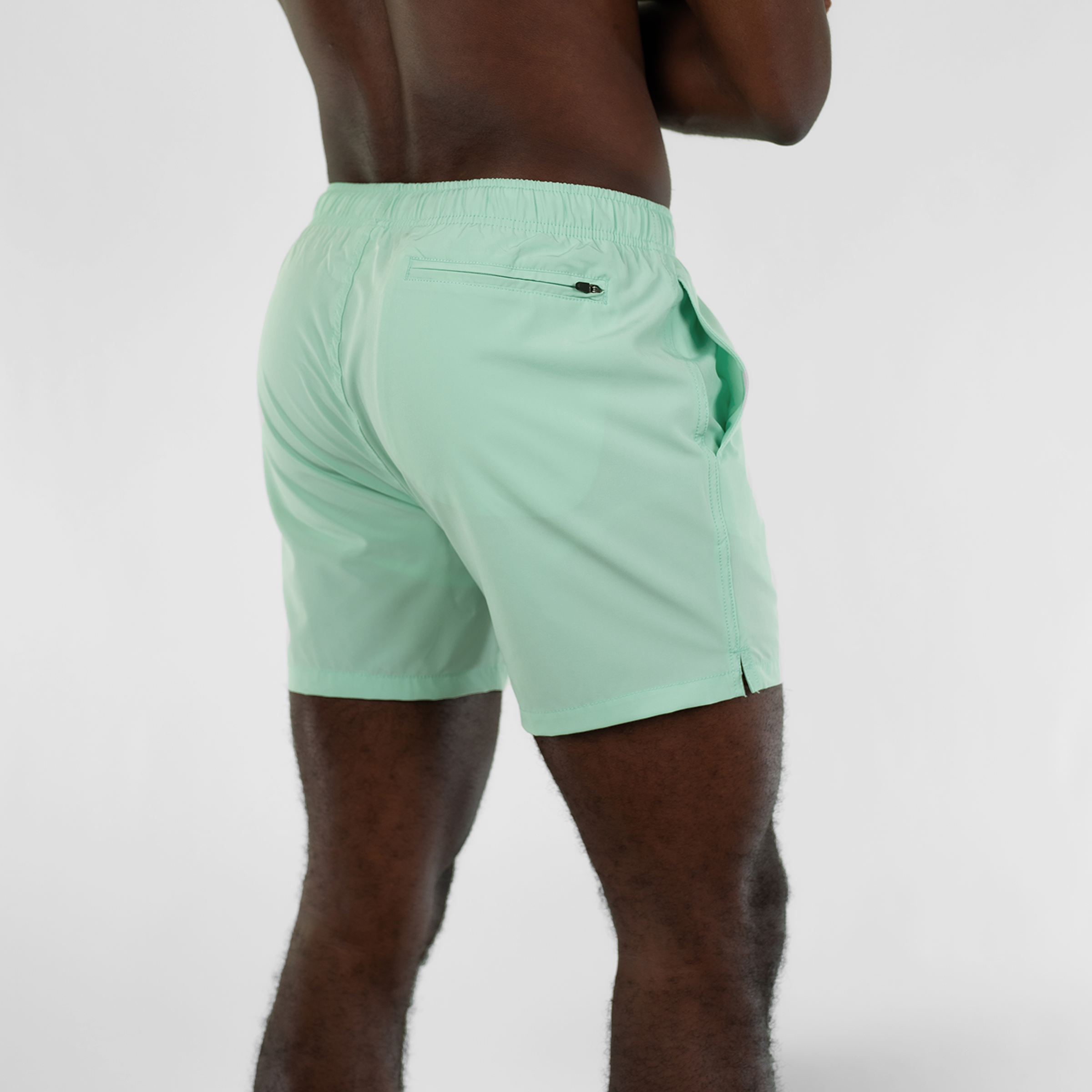 Stretch Swim 5.5" Mint back on model with back right zippered pocket