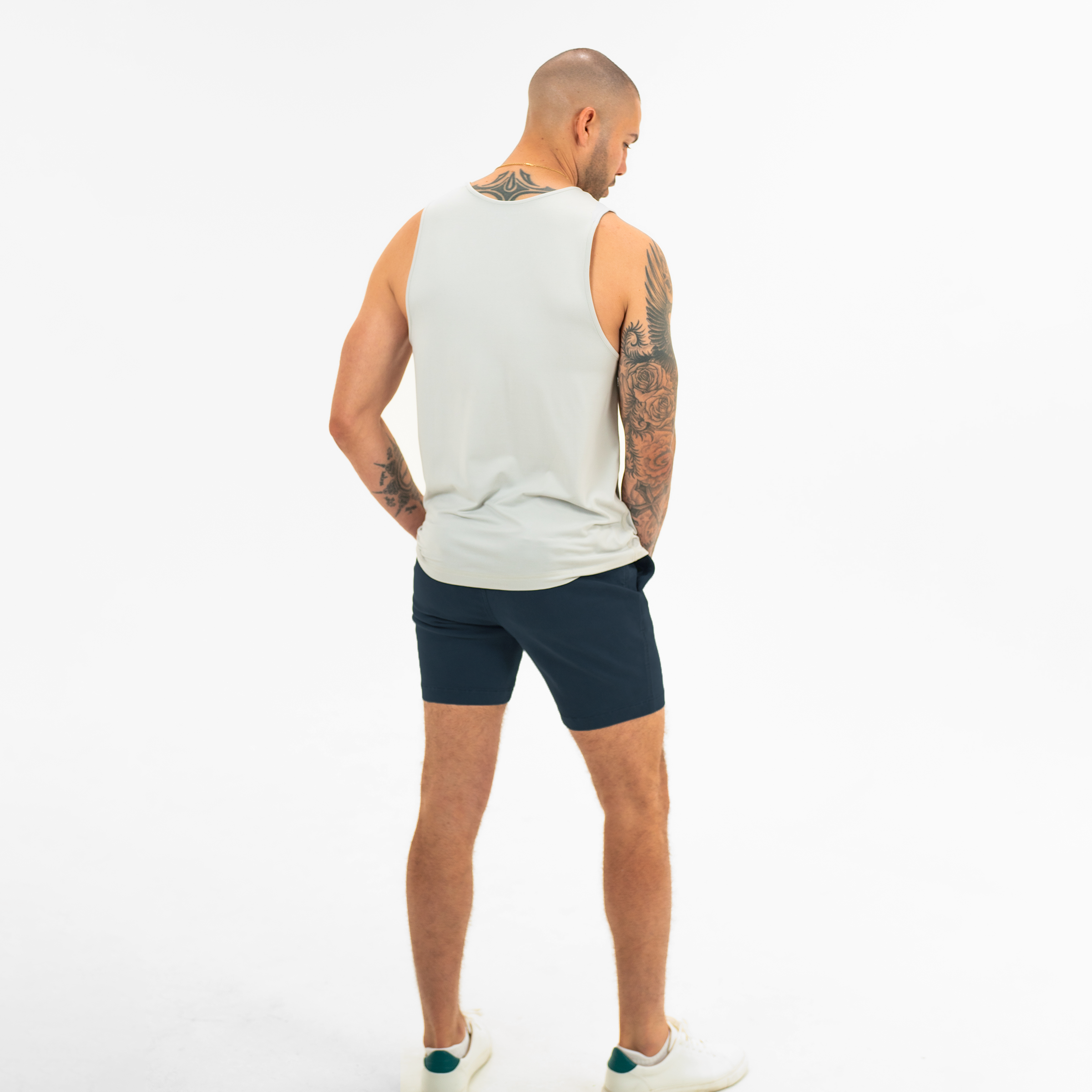 Alto Short 7" inseam in Navy back on model worn with Tech Tank in Quiet Grey