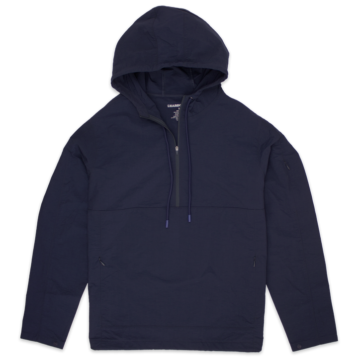 Windbreaker Jacket in Navy blue with kangaroo pocket with zippers, zipper stash pocket on right arm, wrist snaps for secure fit, rubberized hood drawstring, and three-quarter zipper through collar