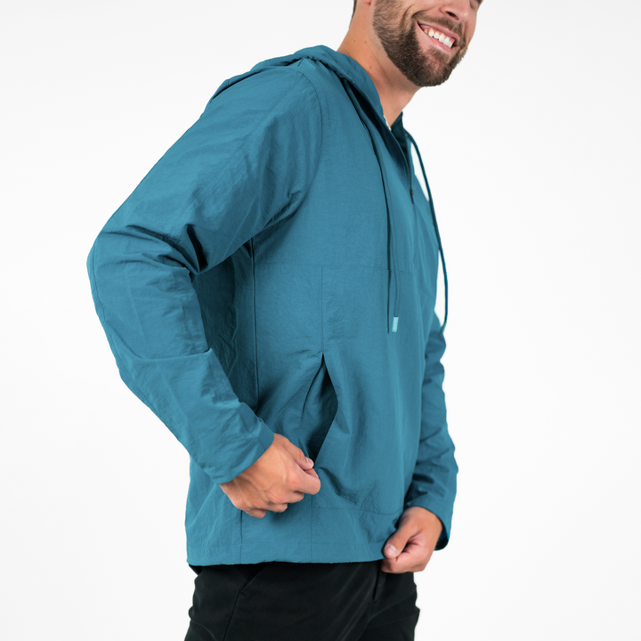 Windbreaker Jacket in Ocean blue side on model close up of kangaroo pocket zipper