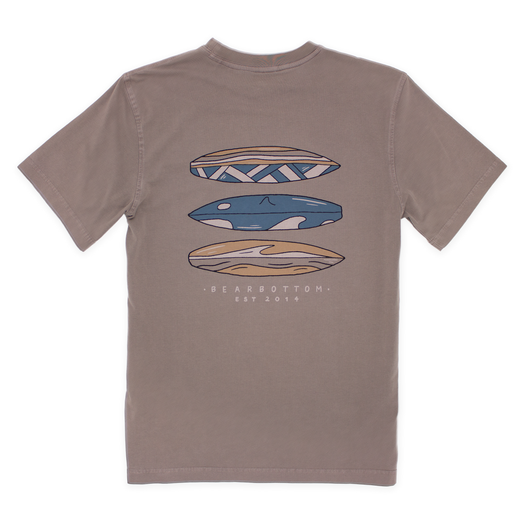 Back of Natural Dye Graphic Tee Riptide with graphic of 3 blue white and yellow surfboards