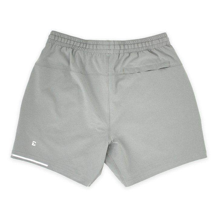 Run Short 5.5" Grey  back with elastic waistband, back right hidden zipper pocket, reflective line on bottom left hem, and reflective Bear B logo on bottom left leg