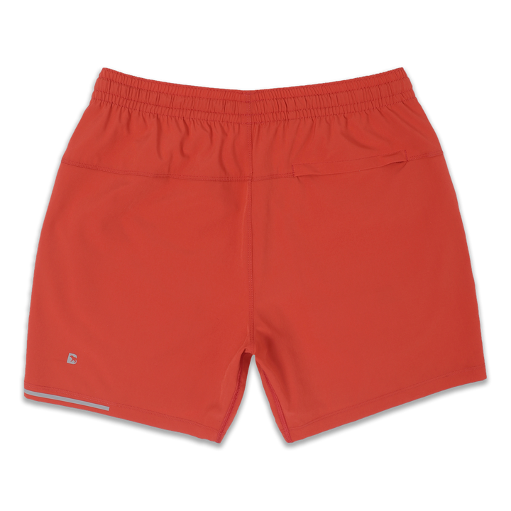 Run Short 5.5" Coral back with elastic waistband, back right hidden zipper pocket, reflective line on bottom left hem, and reflective Bear B logo on bottom left leg