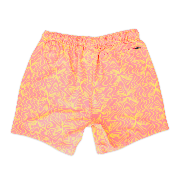 Stretch Swim 5.5" Groovy back, a light pink with bright yellow psychedelic ball shaped pattern with an elastic waistband and back right zippered pocket