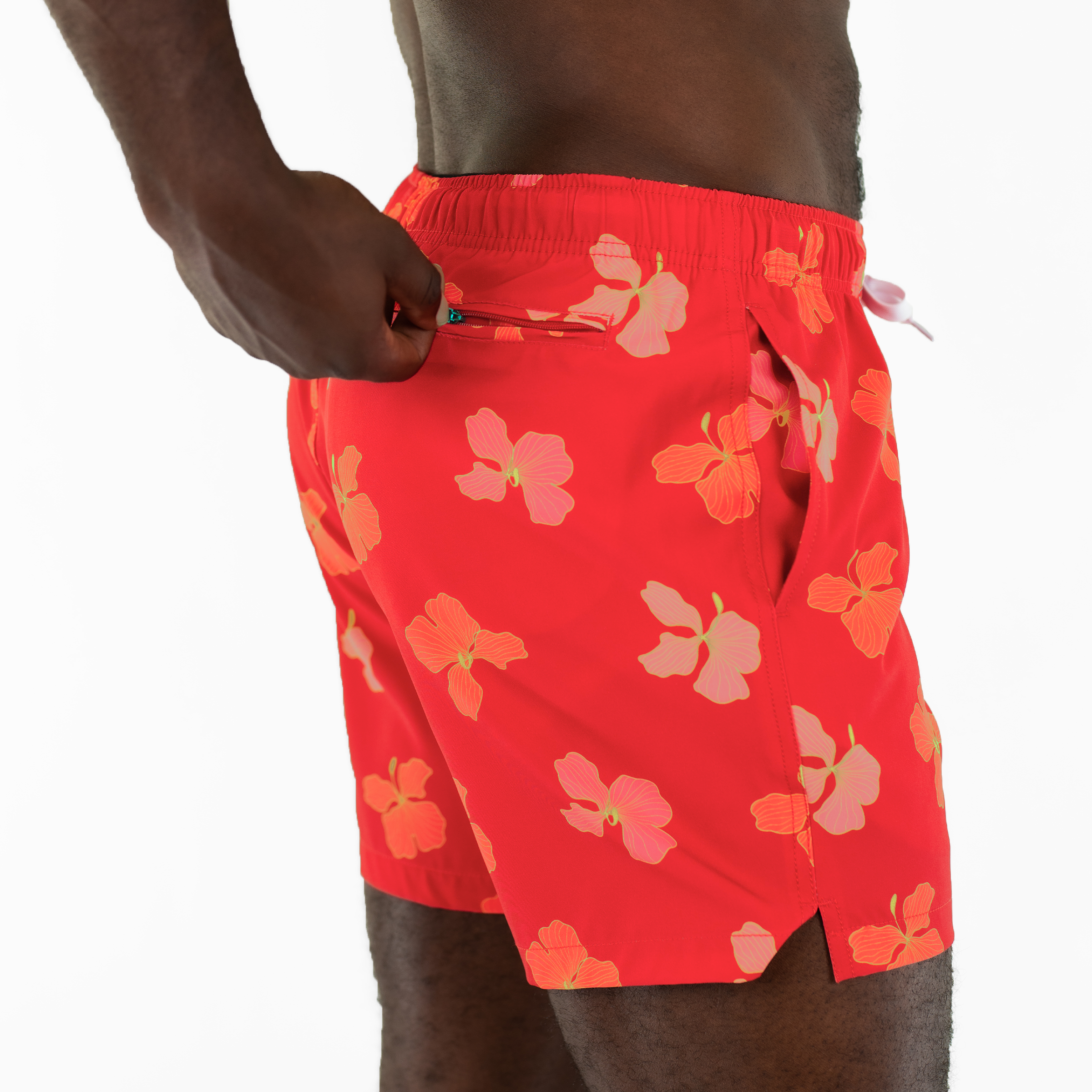 Stretch Swim 5.5" Hibiscus back on model zipping back right zippered pocket