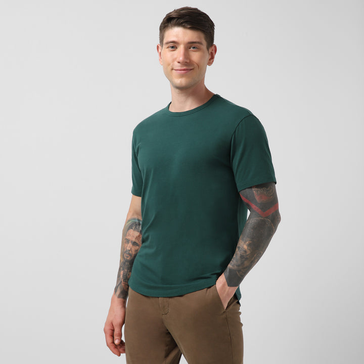 Supima Curved Tee Field Green side on model
