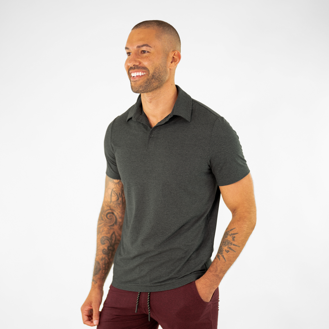 Tech Polo Charcoal on model paired with Tech Short Maroon