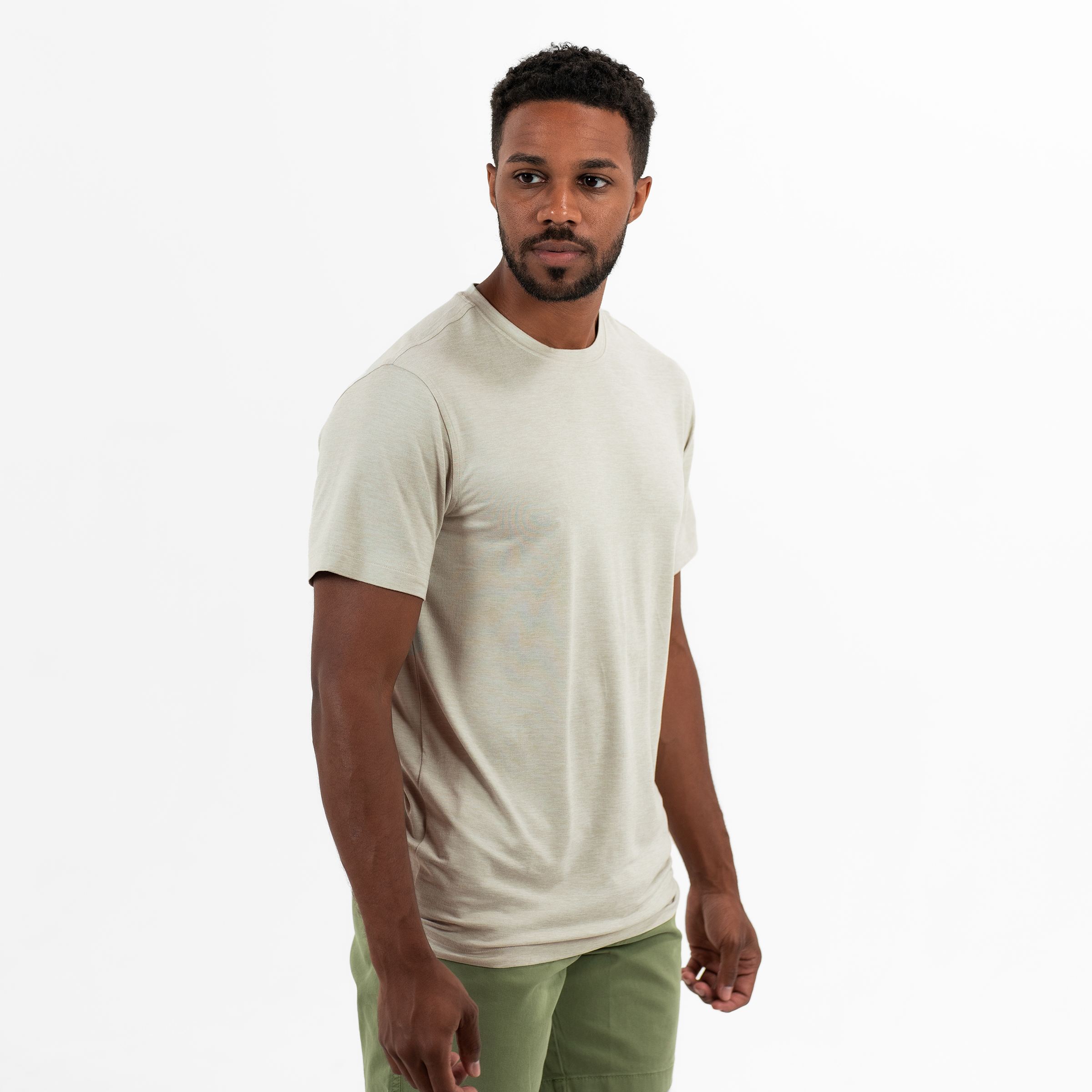 Short Sleeve Tech Tee in Stone side on model with a crew neck and heathered color