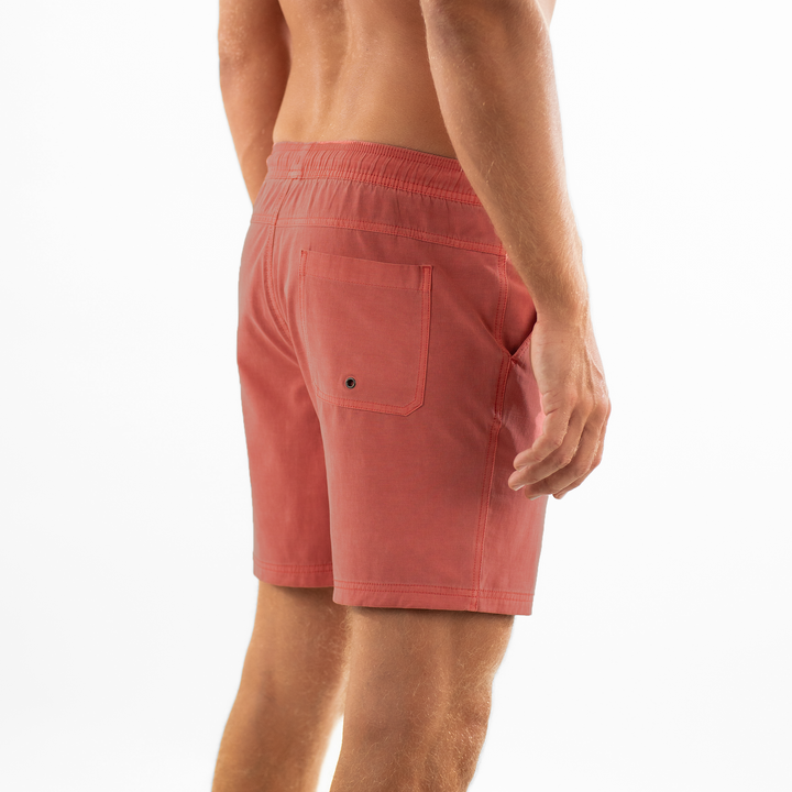 Volley Short 7" Pink side back on model with elastic waistband and back right patch pocket